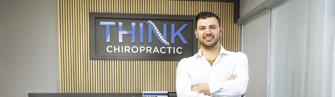 Dr. Anthony Barbati, a chiropractor at Think Chiropractic, wearing a white shirt